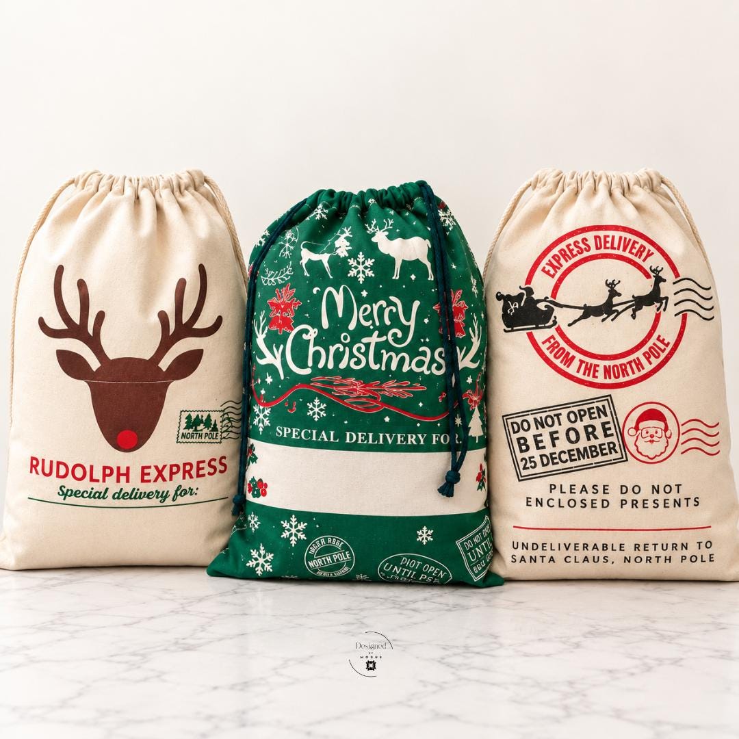 Extra large red and green Christmas Santa sacks featuring white reindeer, festive snowflakes, Merry Christmas lettering and North Pole special delivery graphics. Oversized drawstring holiday gift bags for Christmas presents, Santa gifts, kids holiday surprises, Christmas Eve traditions, reusable gift packaging and personalized Christmas gift sacks. Festive holiday designs with custom name options.