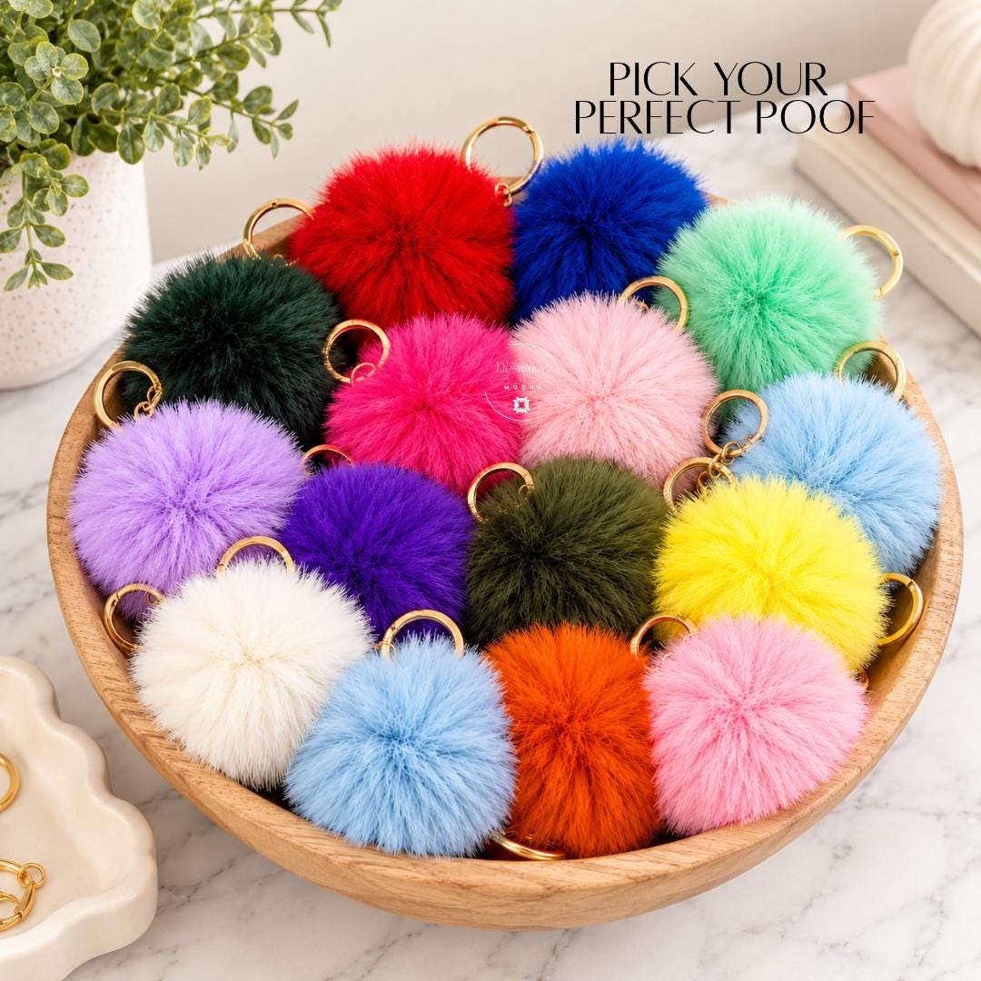 Assorted fluffy pom pom purse charms featuring vibrant red, royal blue, bright pink, lavender, mint green, yellow, orange and neutral shades with gold-tone key rings. Decorative fluffy keychain accessories for handbags, backpacks, school bags, tote bags and everyday keys. Fun stocking stuffer gifts, teen girl accessories, friendship gifts and colorful purse decorations.